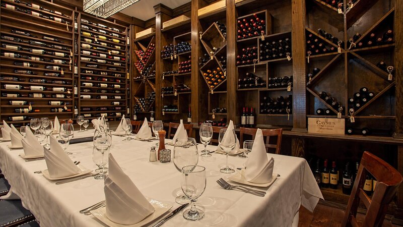 Private party room with wine racks on the walls
