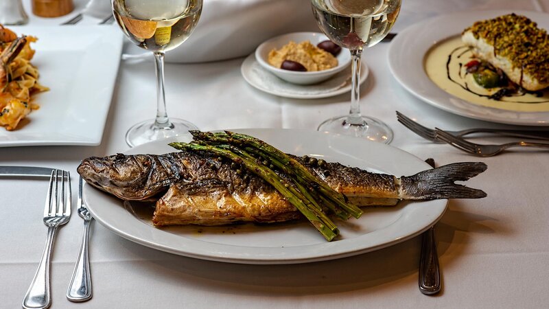 Whole branzino entree with side of asparagus