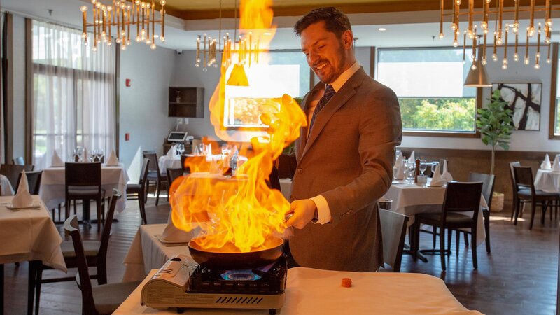 Management flambéing in dinning room